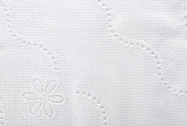 Photo of Perforated toilet paper as background, closeup. Personal hygiene