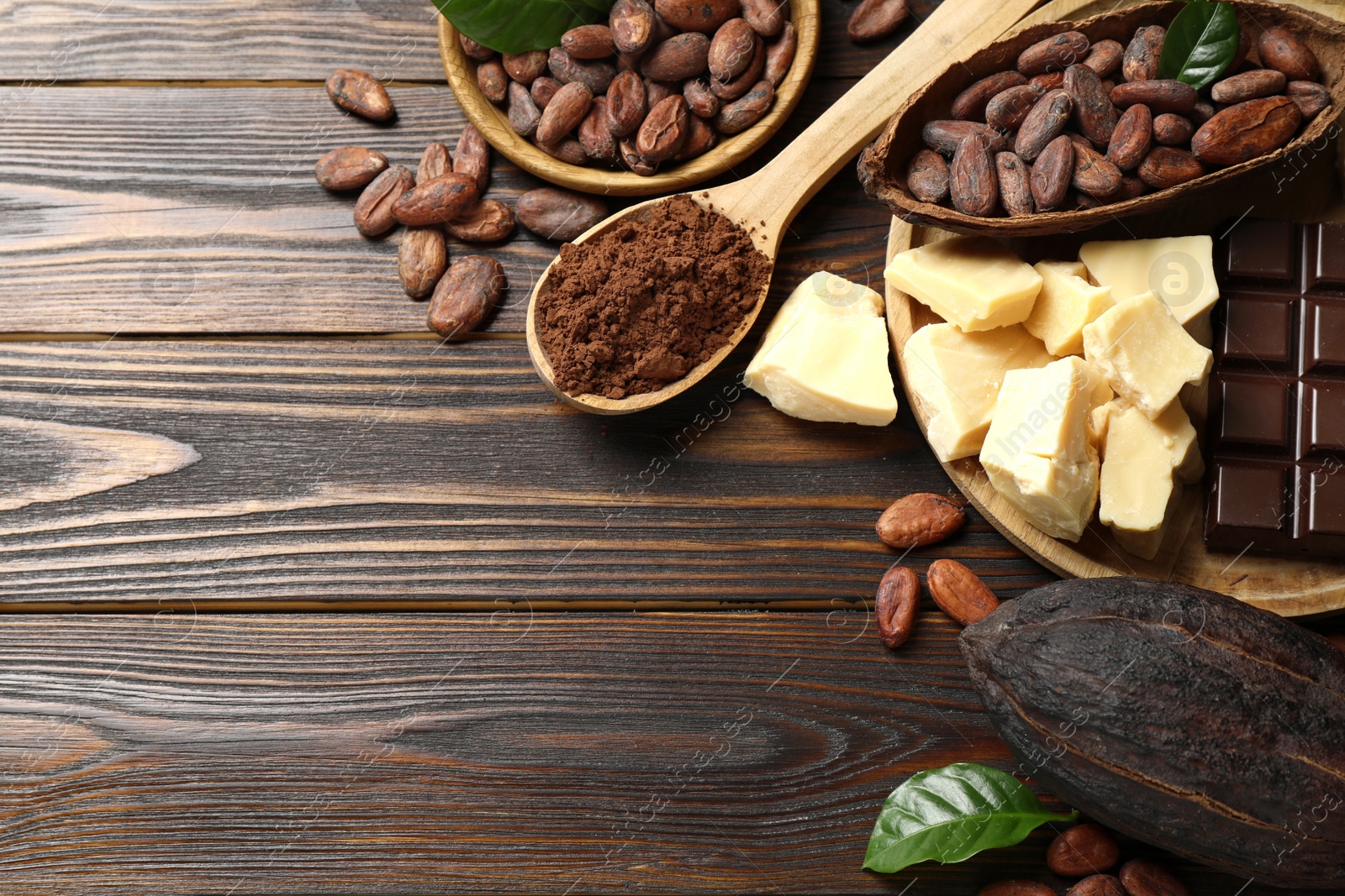 Photo of Flat lay composition with organic cocoa butter on wooden table. Space for text