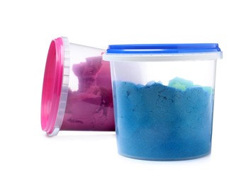 Photo of Kinetic sand and toys in buckets on white background