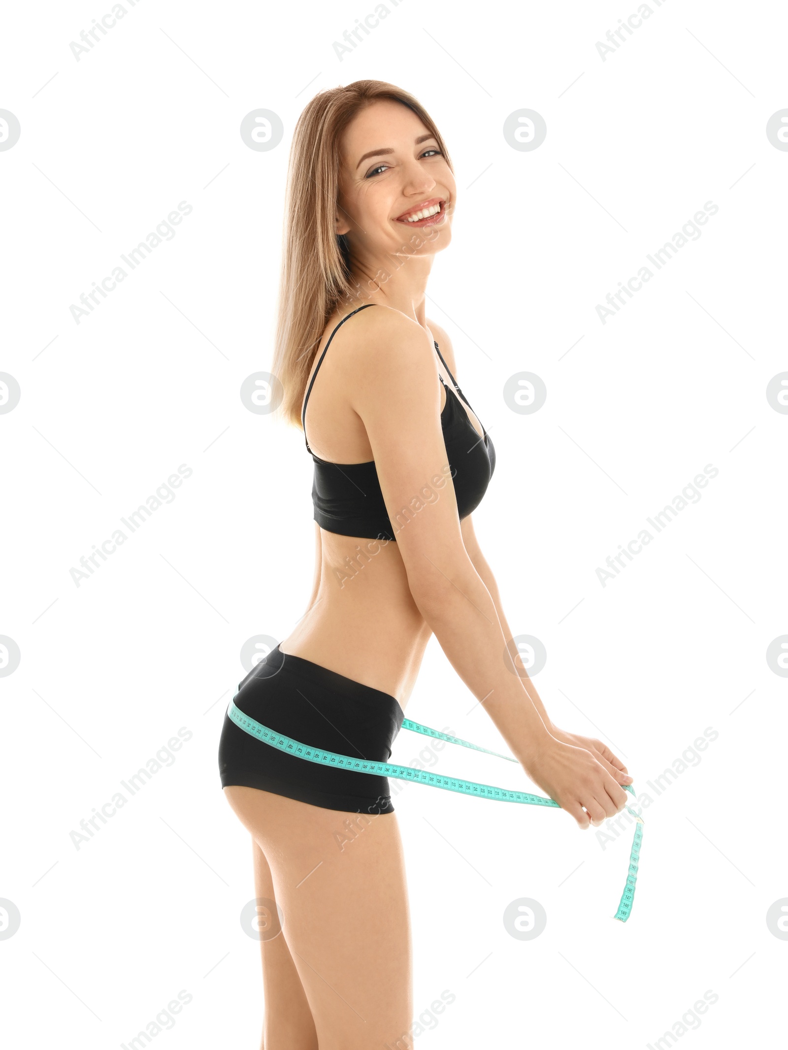 Photo of Slim woman measuring her hips on white background. Perfect body