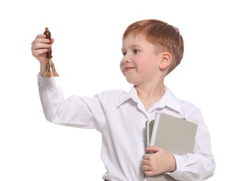 Photo of Pupil with school bell and books on white background