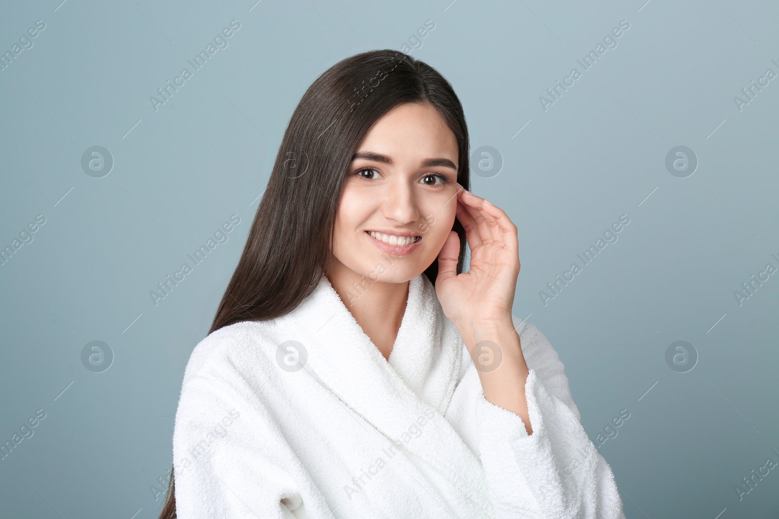 Photo of Portrait of beautiful woman on color background. Cosmetology and spa