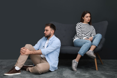 Photo of Unhappy couple with problems in relationship at home