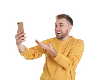 Photo of Young man using video chat on smartphone against white background