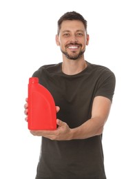 Photo of Man showing red container of motor oil on white background