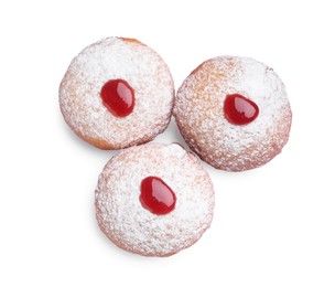 Photo of Hanukkah donuts with jelly and powdered sugar isolated on white, top view