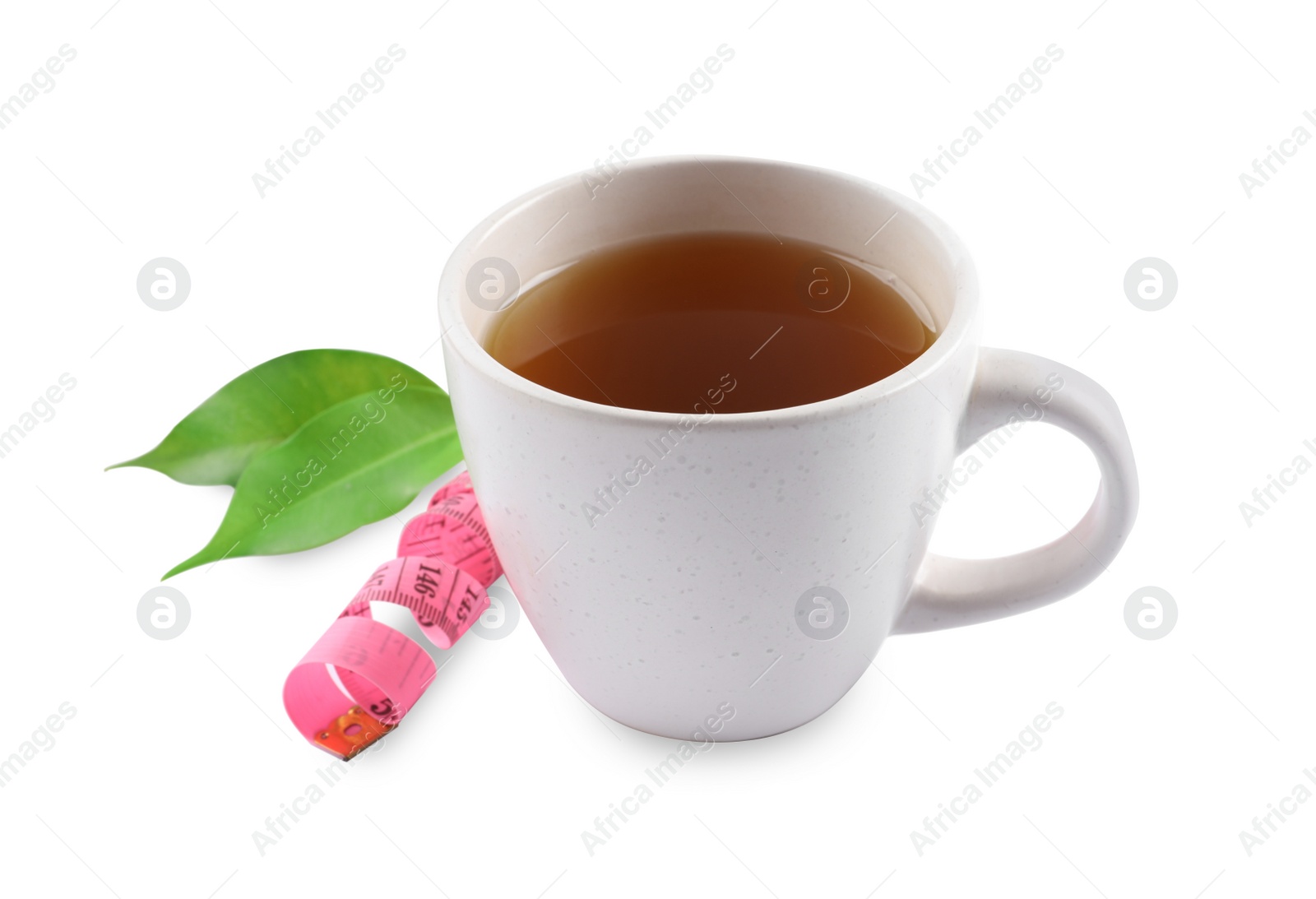 Photo of Ceramic cup of diet herbal tea, measuring tape and fresh leaves on white background. Weight loss