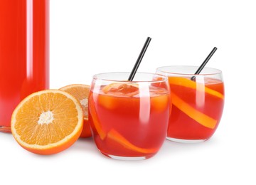 Photo of Aperol spritz cocktail, straws and orange slices in glasses isolated on white