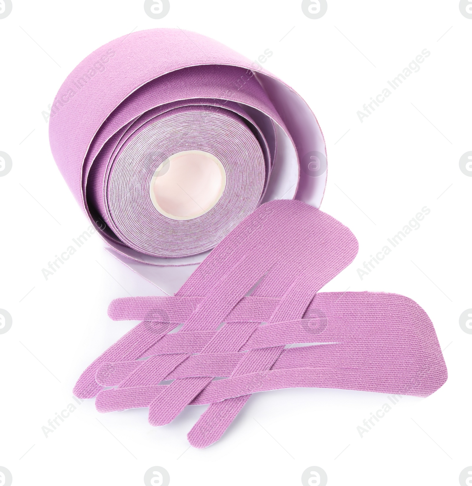 Photo of Violet kinesio tape roll and pieces on white background
