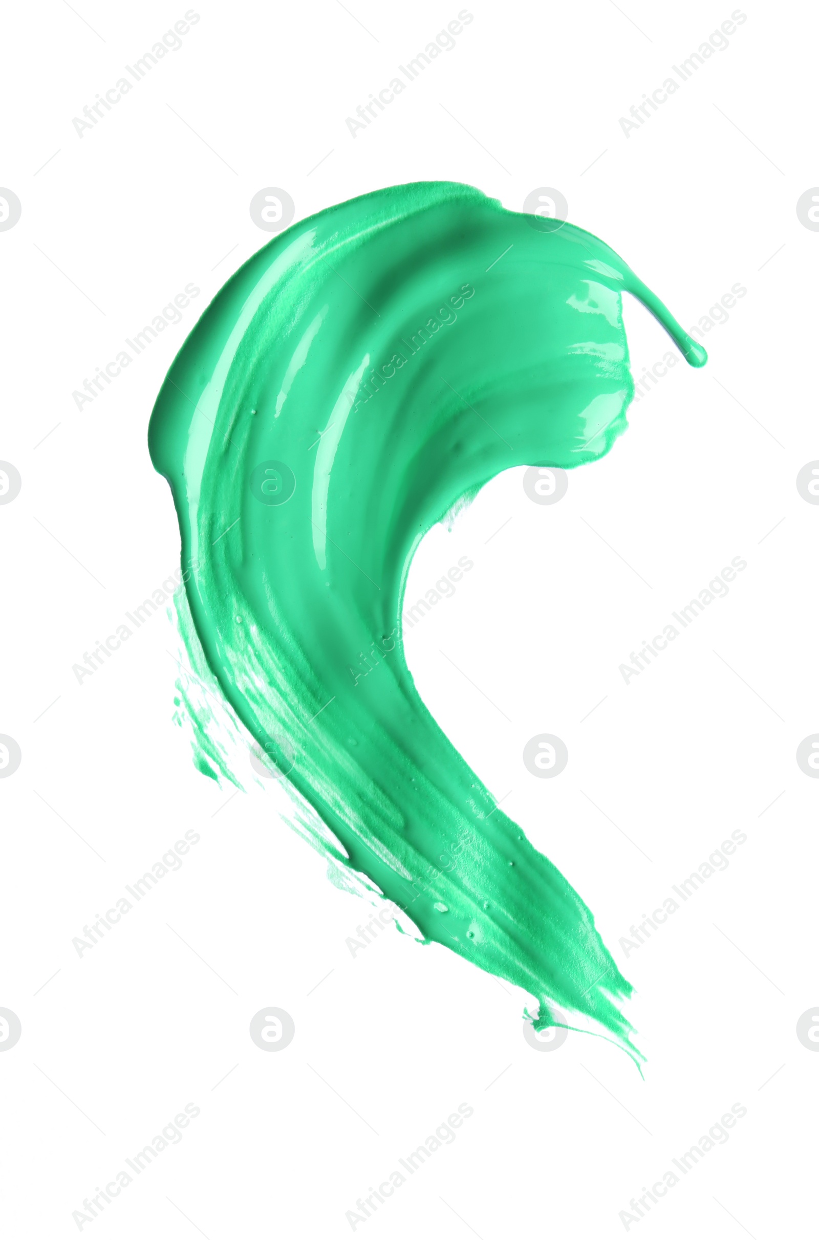 Photo of Abstract brushstroke of green paint isolated on white