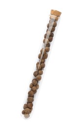 Photo of Glass tube with allspice peppercorns on white background, top view
