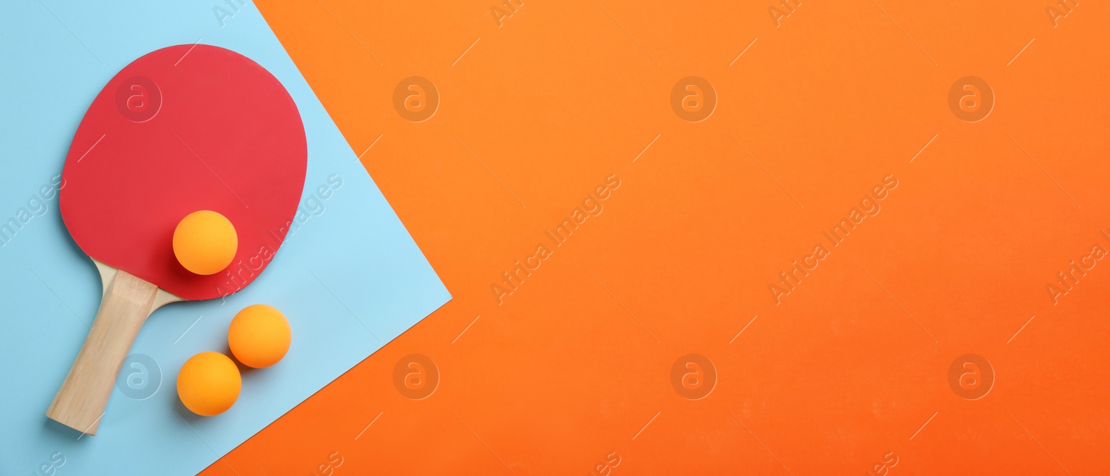 Image of Ping pong racket and balls on color background, flat lay. Space for text. Banner design