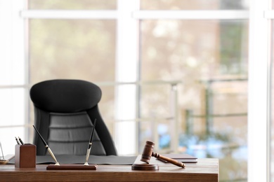 Table with judge gavel in lawyer's office