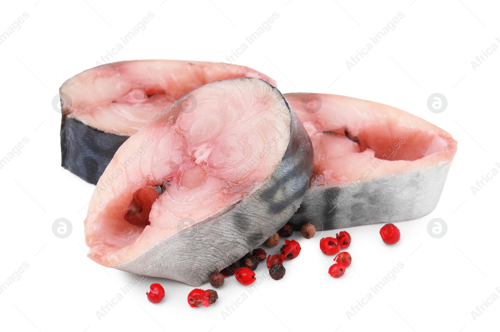Photo of Pieces of mackerel fish with spices on white background