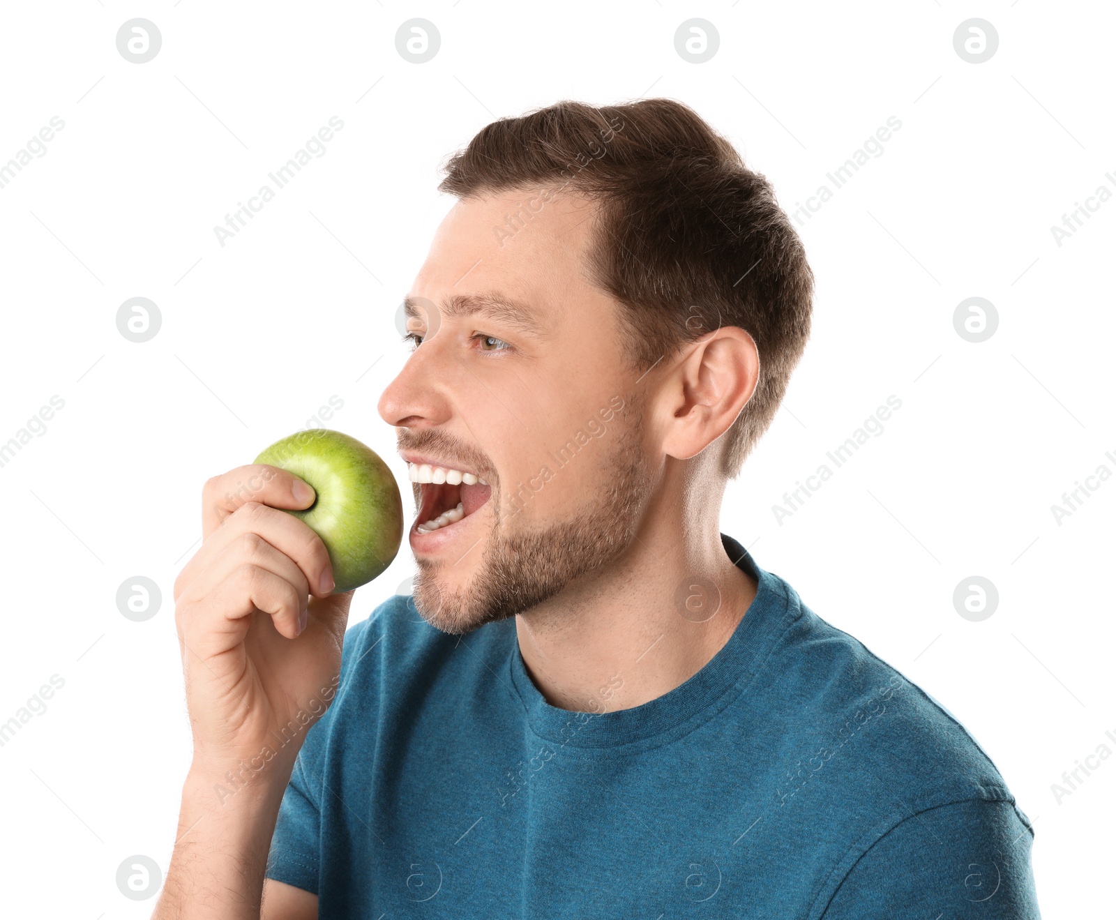 Photo of Man with perfect teeth and green apple on white background