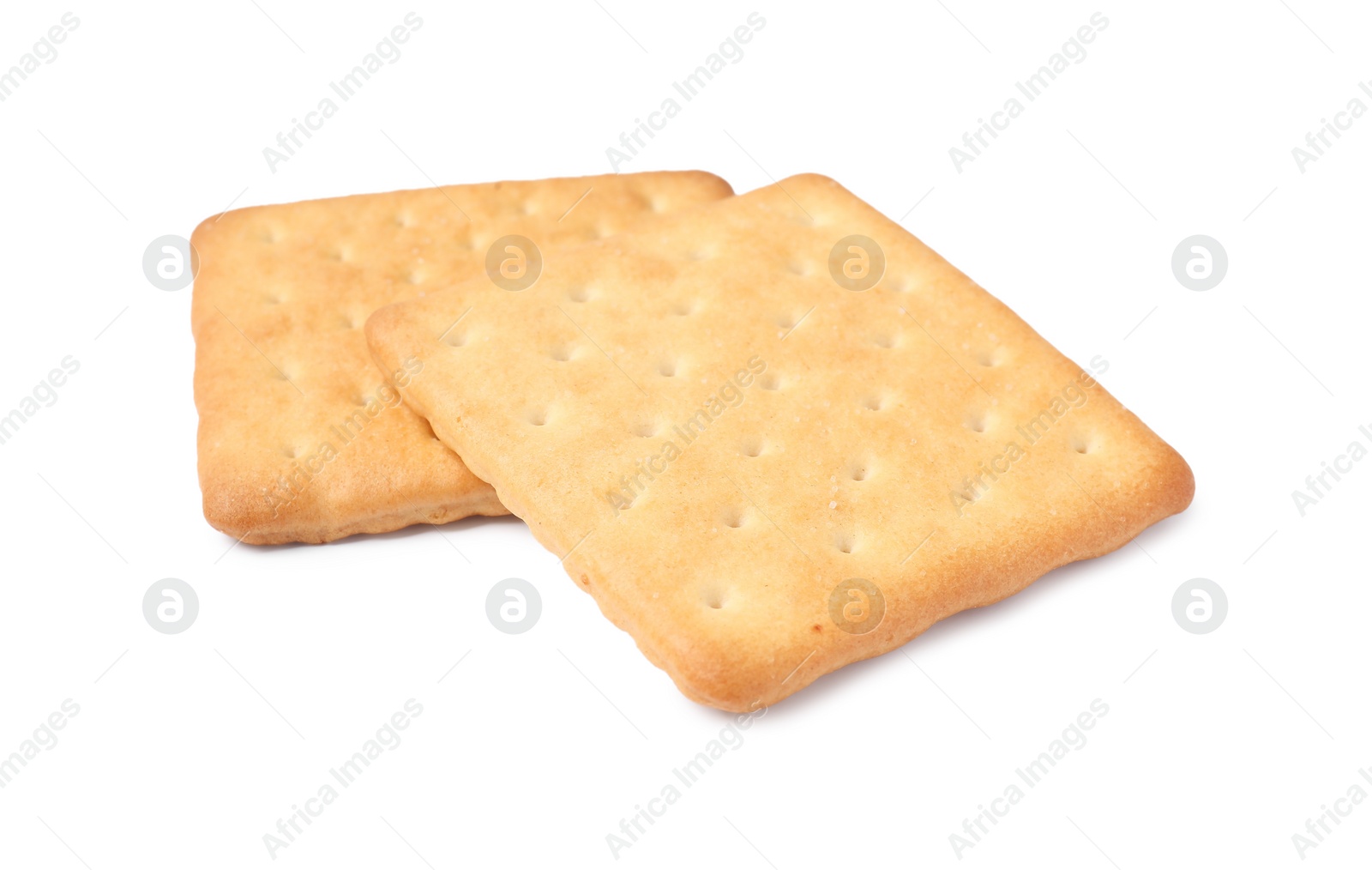 Photo of Two crispy crackers isolated on white. Delicious snack