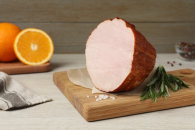 Photo of Delicious ham, rosemary and salt on wooden table