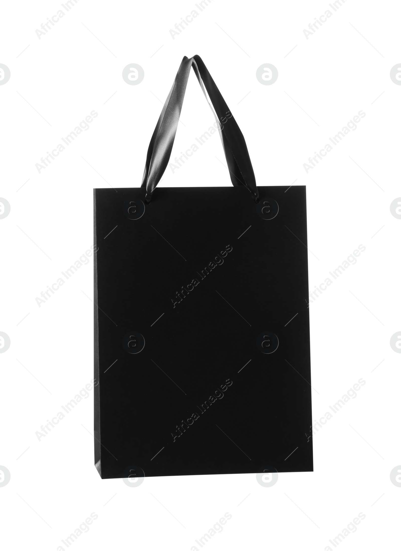 Photo of One black paper bag isolated on white