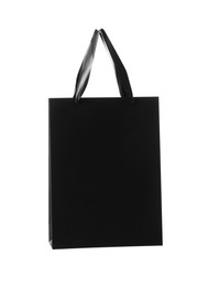 Photo of One black paper bag isolated on white