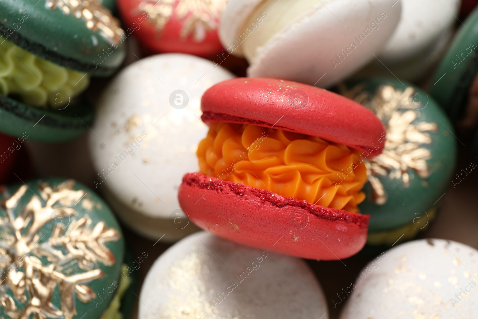 Photo of Beautifully decorated Christmas macarons as background, closeup