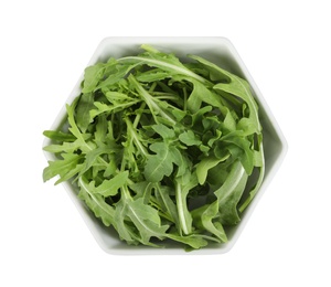 Delicious fresh arugula in bowl isolated on white, top view