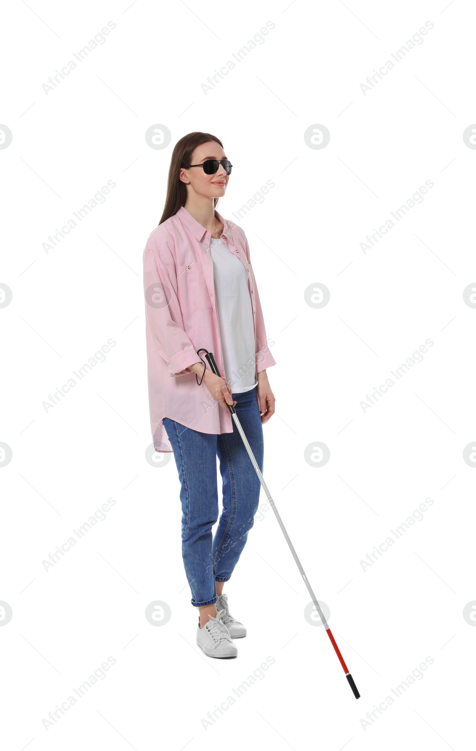 Photo of Blind woman with long cane on white background