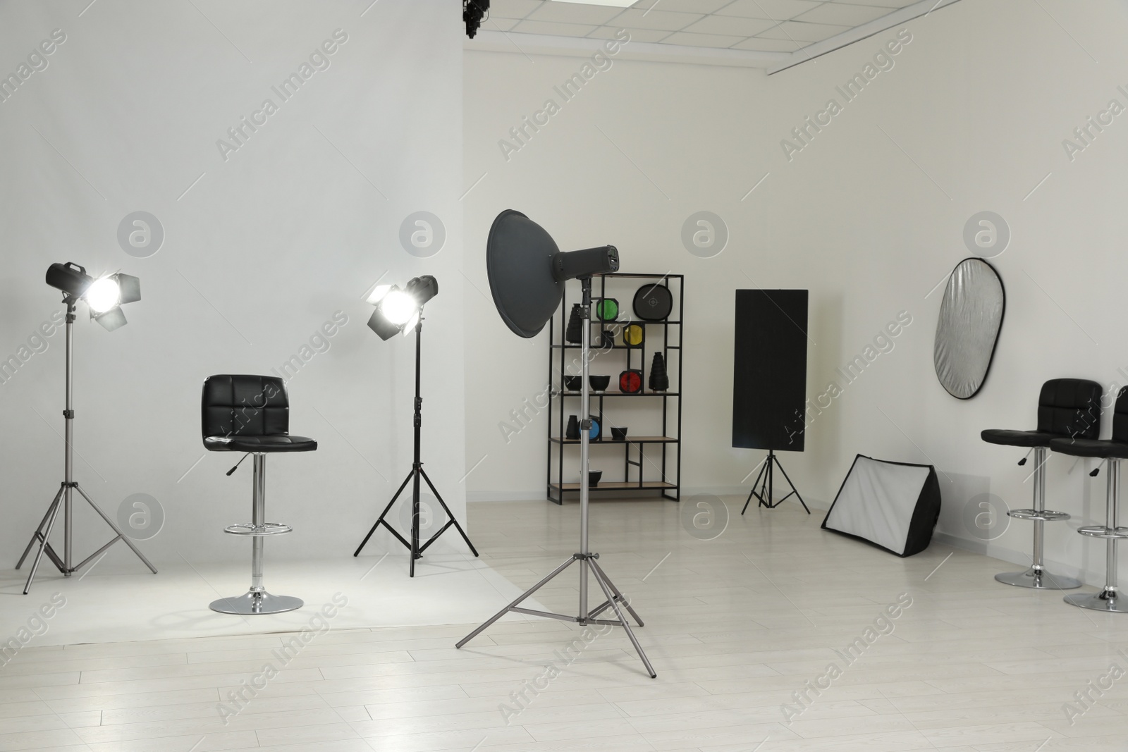 Photo of Interior of modern photo studio with professional equipment