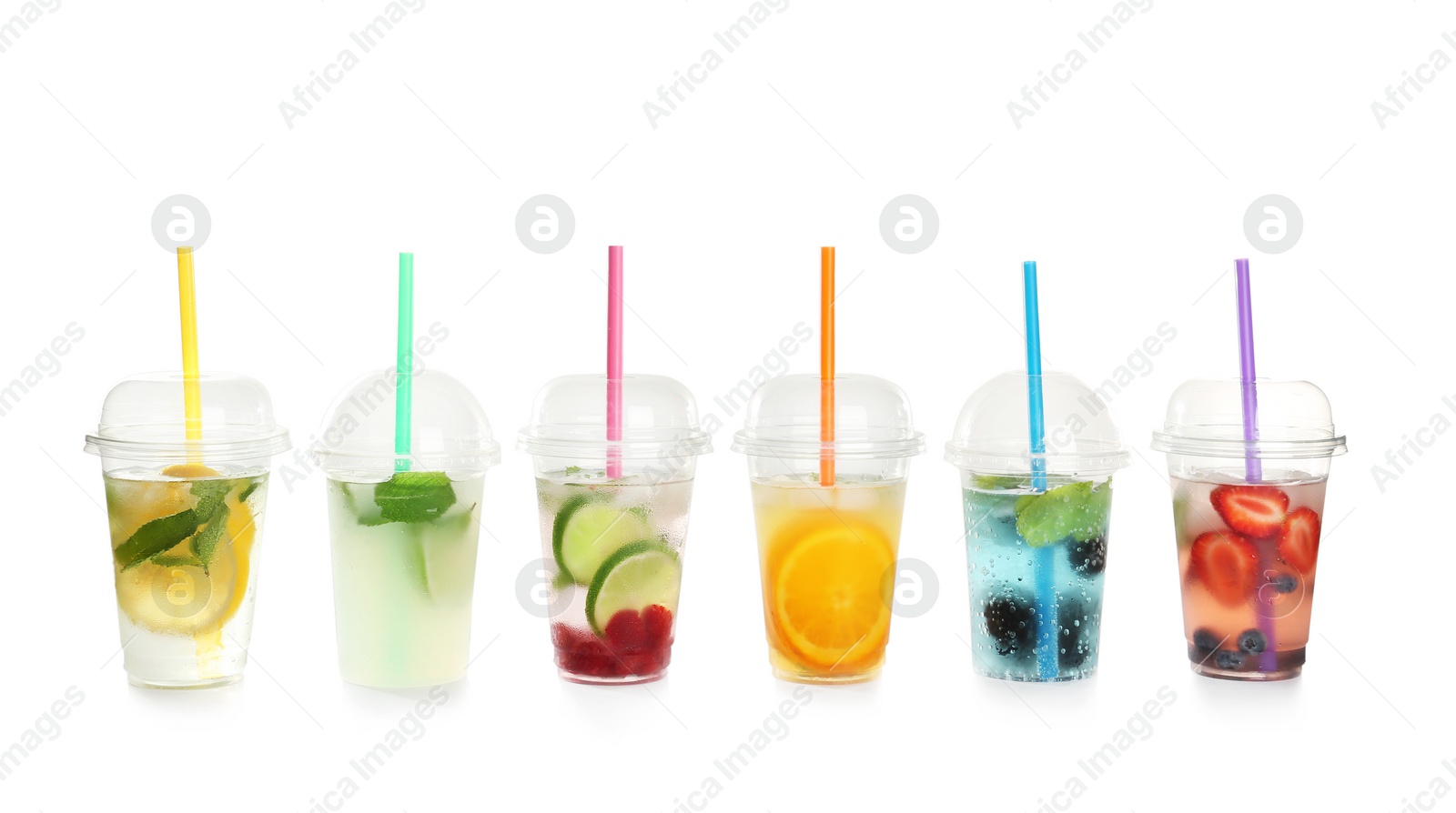 Photo of Plastic cups with lemonades on white background