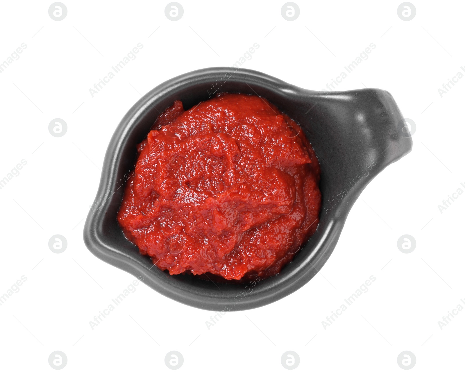 Photo of Gravy boat with tasty tomato paste isolated on white, top view