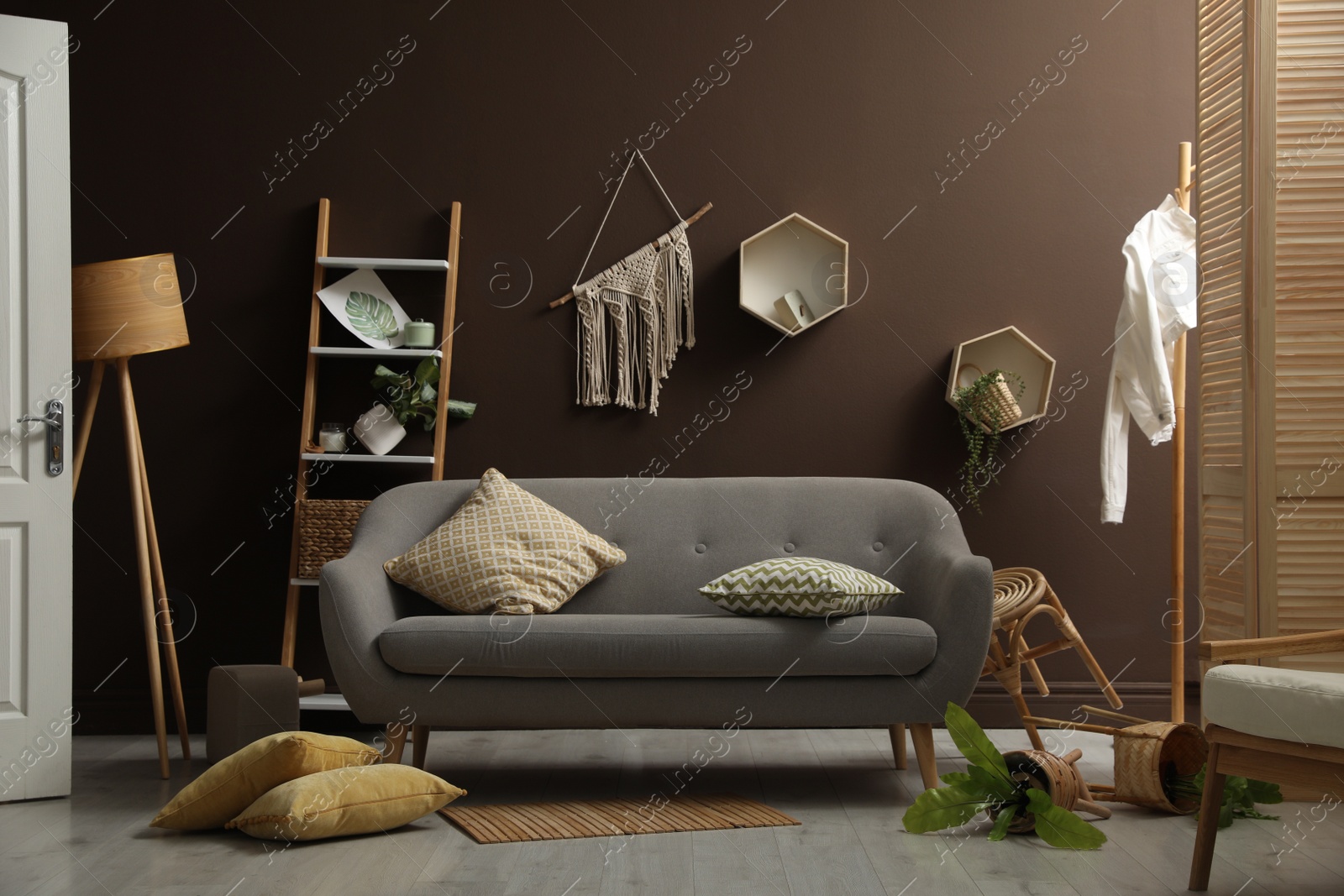 Photo of View on messy living room interior after earthquake