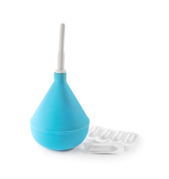 Light blue enema and suppositories on white background