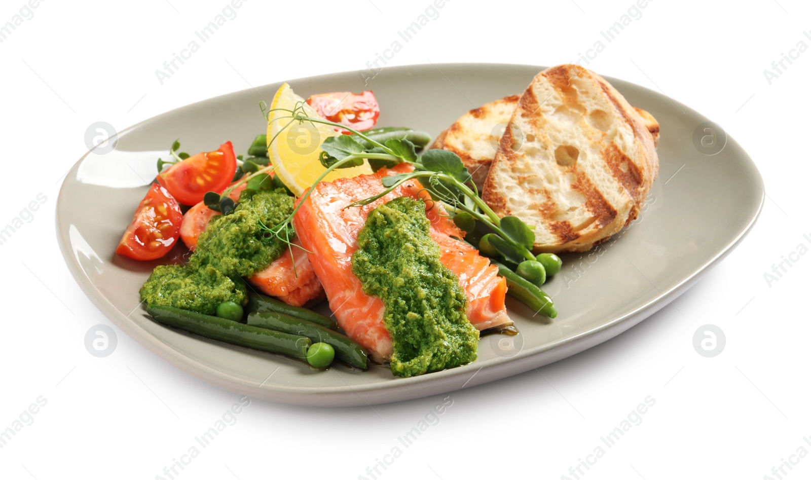 Photo of Tasty cooked salmon with pesto sauce and fresh salad on white background