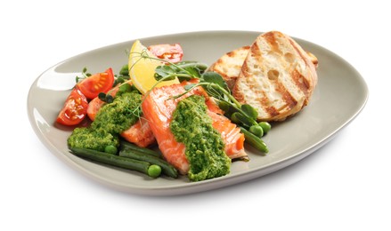 Photo of Tasty cooked salmon with pesto sauce and fresh salad on white background