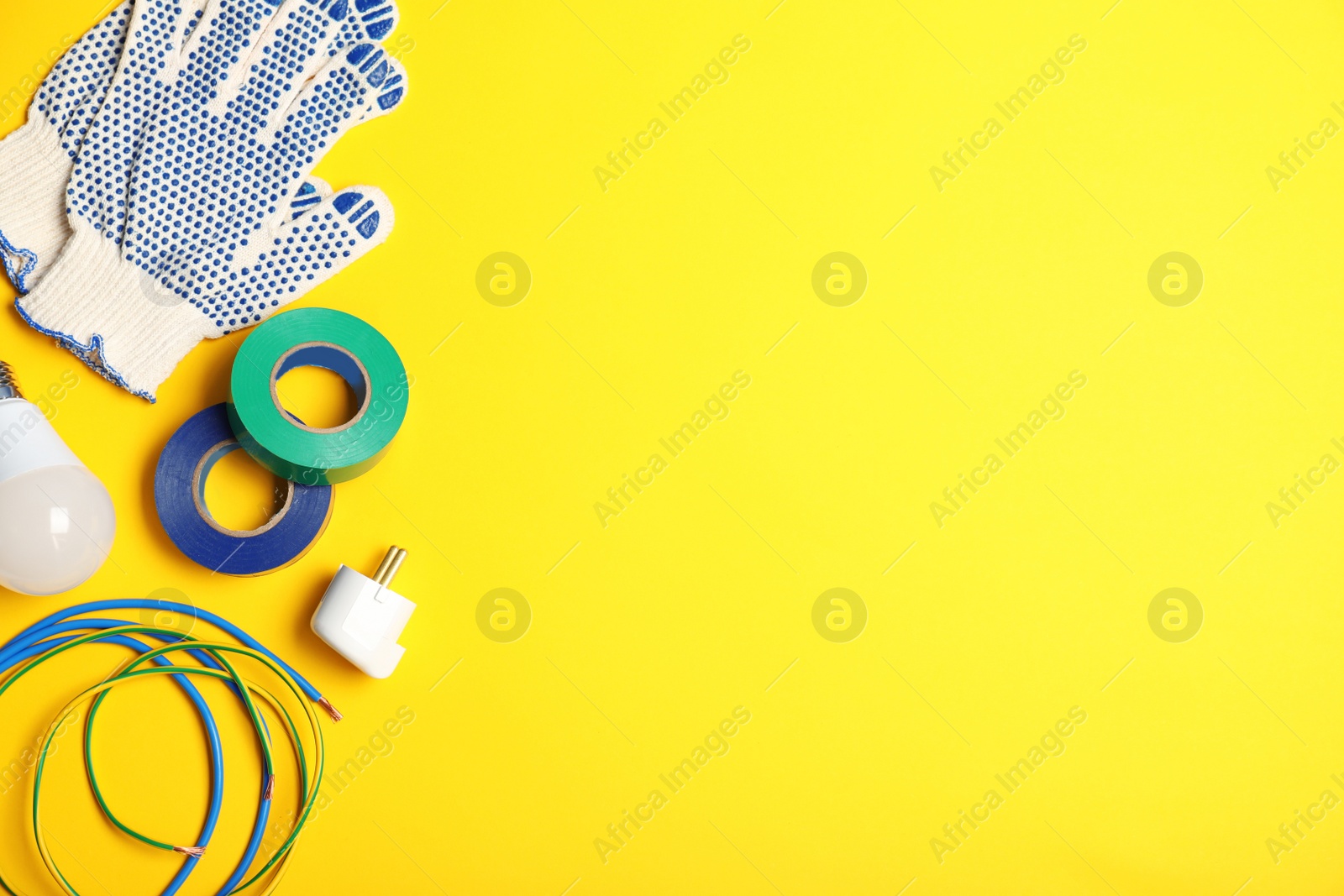 Photo of Flat lay composition with electrician's tools and space for text on color background