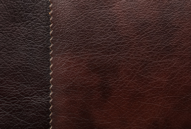 Photo of Leather samples of different colors for design as background, closeup