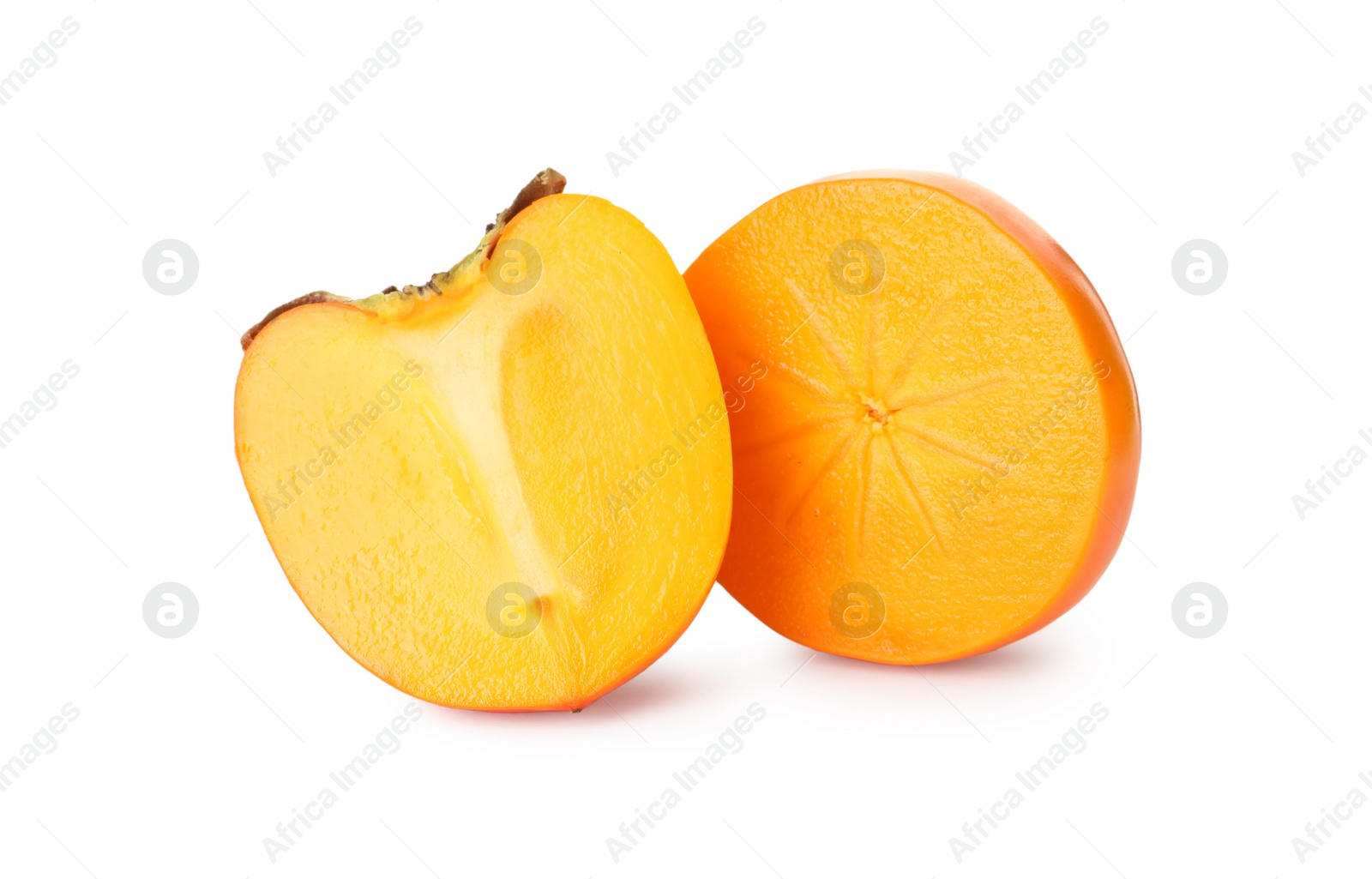 Photo of Halves of delicious ripe juicy persimmons on white background