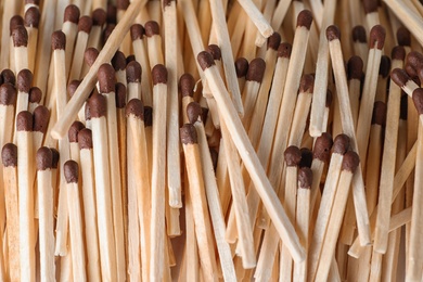 Photo of Pile of wooden matches as background, top view
