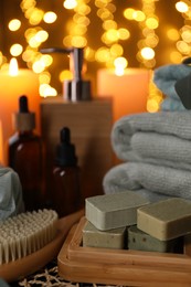 Photo of Beautiful composition with different spa products on table against blurred lights