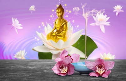 Composition with smoldering incense stick on table and Buddha figure on background