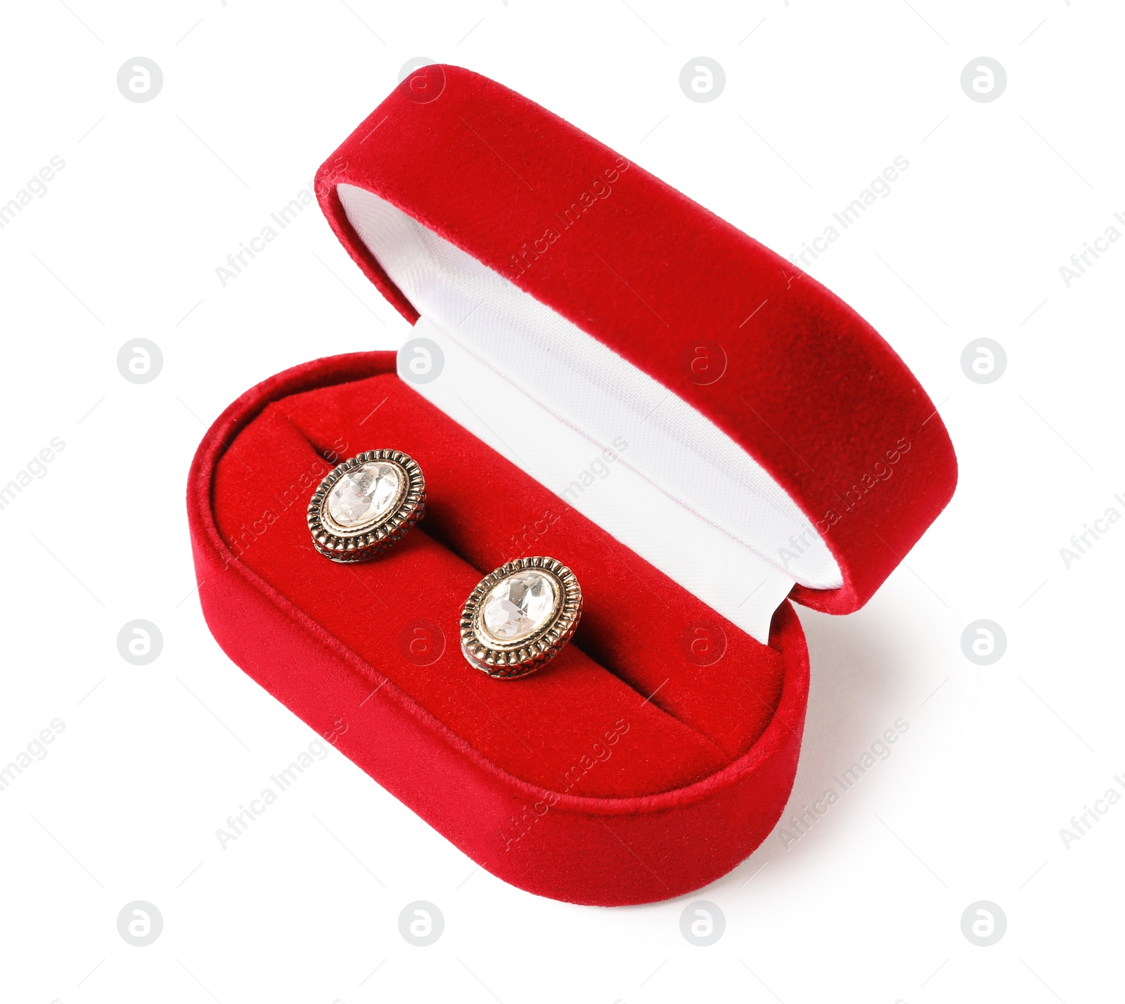 Photo of Open box with stylish studs isolated on white. Luxury jewelry