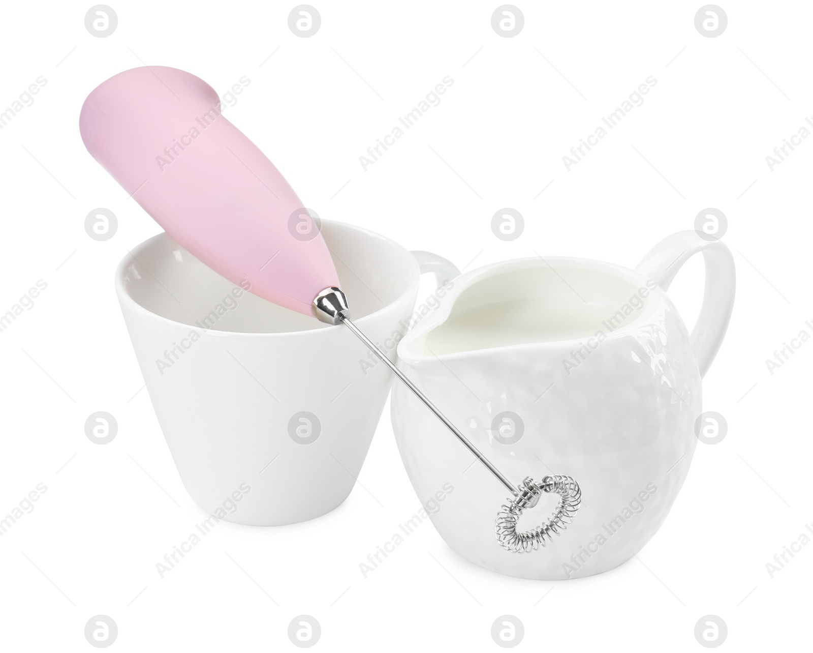 Photo of Milk frother wand, cup and pitcher isolated on white