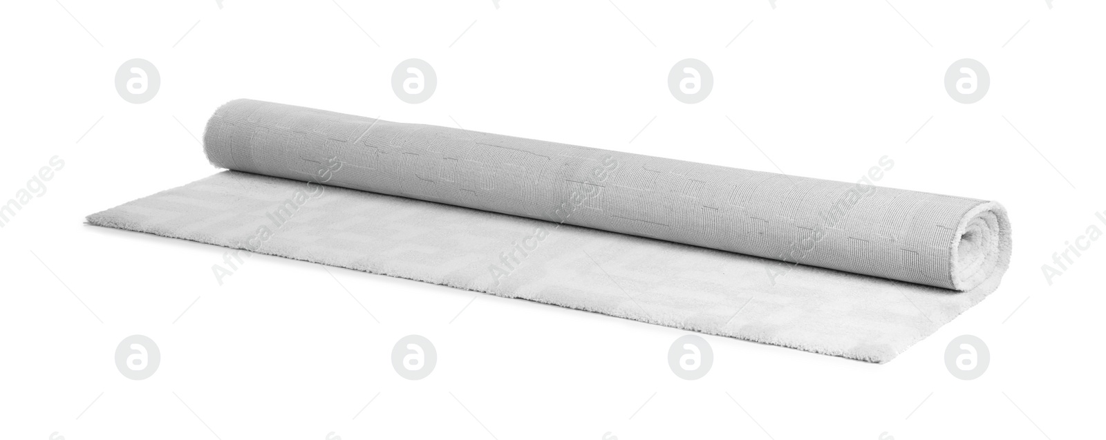 Photo of Rolled soft carpet on white background. Interior element