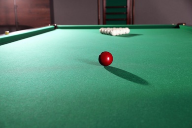 Different balls on modern billiard table indoors