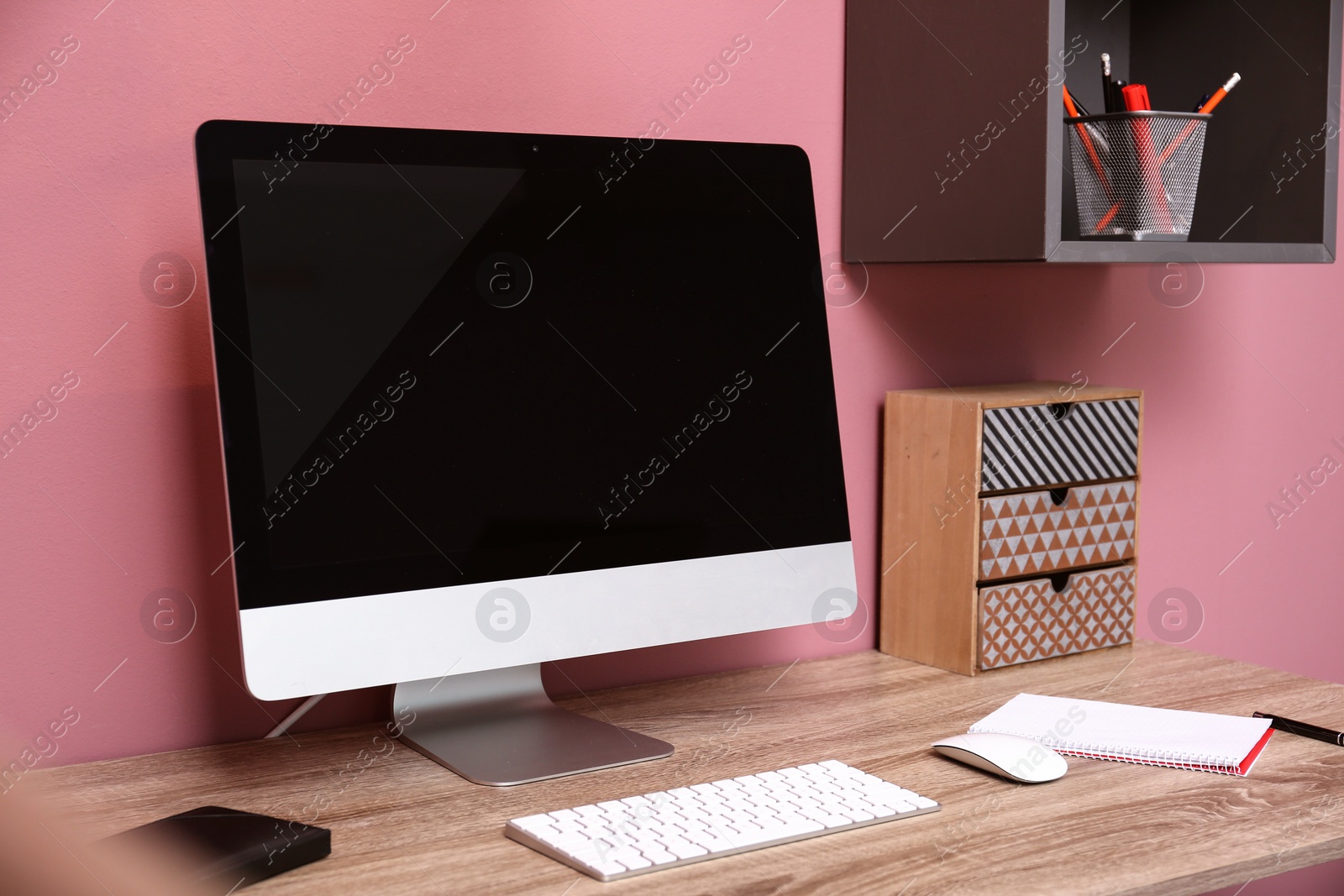 Photo of Comfortable workplace with computer on desk in home office