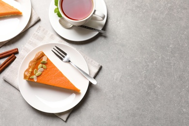 Photo of Flat lay composition with fresh delicious homemade pumpkin pie on table. Space for text