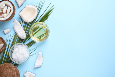 Photo of Flat lay composition with coconut oil on light blue background, space for text