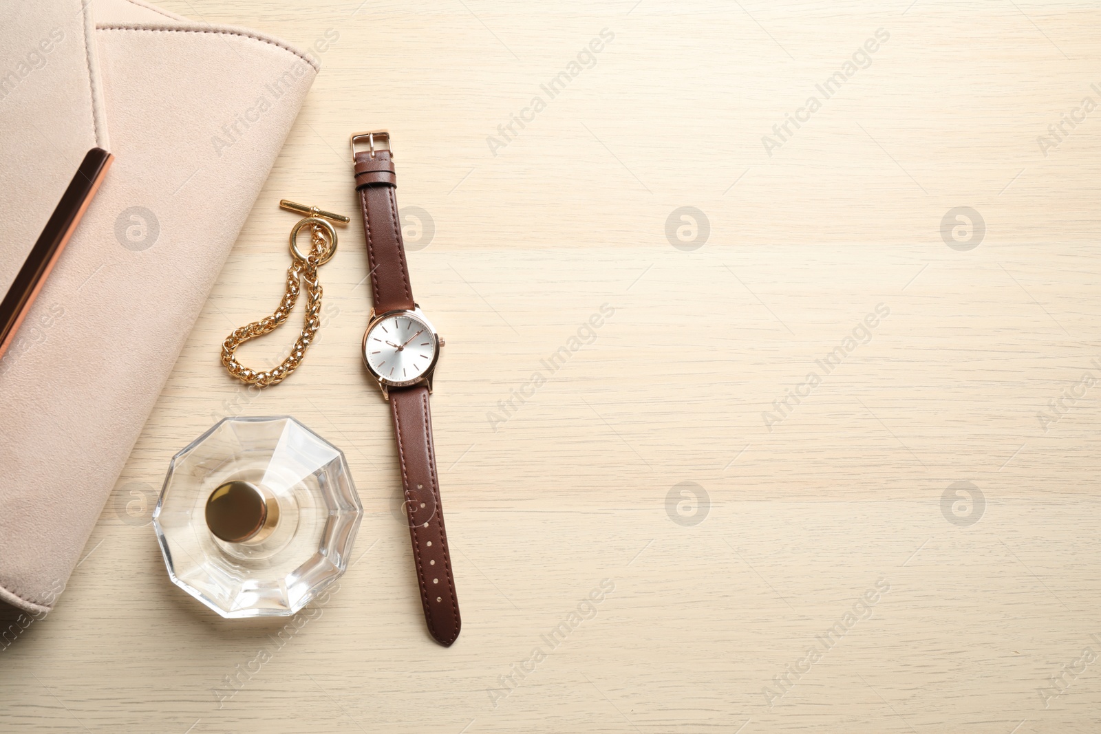 Photo of Flat lay composition with luxury wrist watch on wooden background. Space for text