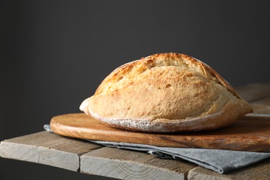 Freshly baked sourdough bread on wooden table