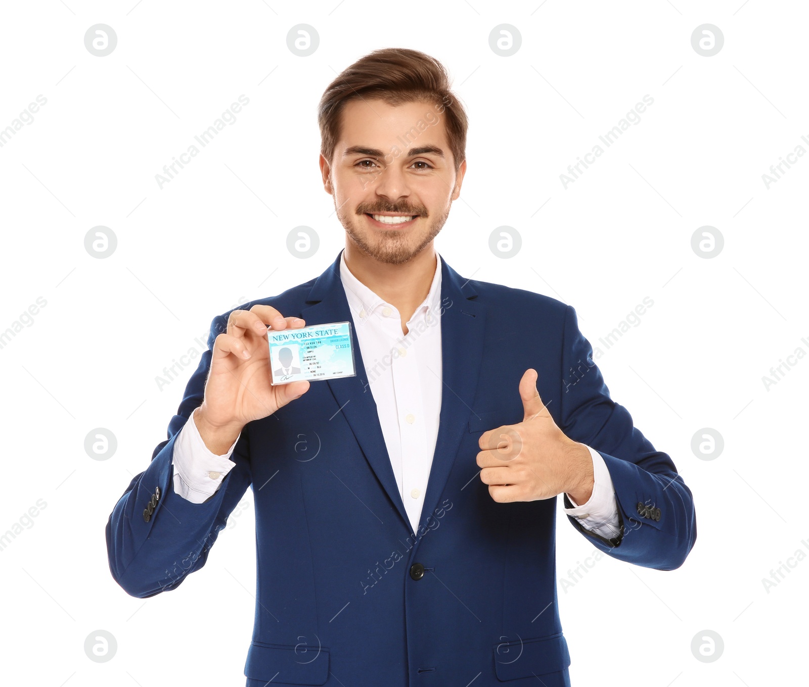 Photo of Happy young businessman with driving license on white background