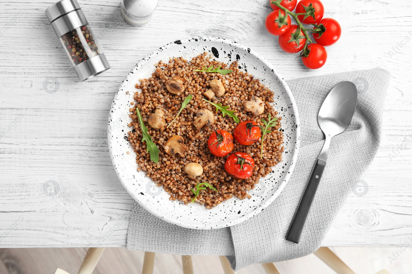 Photo of Flat lay composition with tasty buckwheat porridge on white wooden table